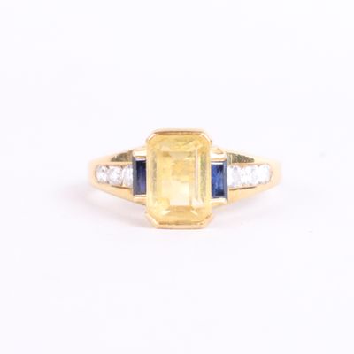 a yellow sapphire and diamond ring