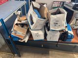 many boxes of electronic equipment sitting on a table
