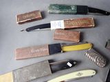 many different types of knives and knives on the table