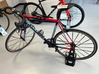 a bike that is sitting on a stand in a store