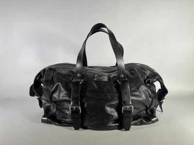 black leather duffel bag on a white background