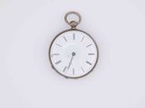 a white clock with roman numerals on the face of it