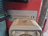 a close up of a machine with a button on it