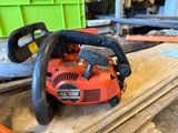 a chainsaw sitting on top of a piece of wood