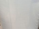 a white vase that is sitting on a table