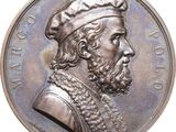 un gros plan d'une pièce de monnaie sur laquelle figure un homme coiffé d'un chapeau