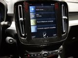 a car dashboard with a steering wheel and dashboard controls