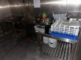 a kitchen with stainless steel cabinets and a sink