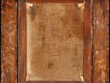 an old wooden frame with a picture of a person in it