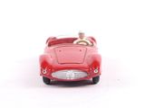 a red toy car with a man in the back seat