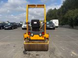 a yellow machine that is sitting in a parking lot