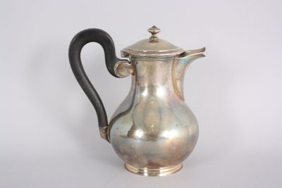 a silver coffee pot with a black handle on a white background
