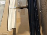 a stack of boxes sitting on the floor next to a cardboard box