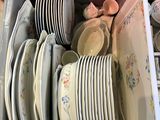 a lot of plates and bowls in a box