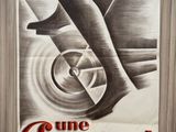 a black and white photo of a poster on a wooden wall