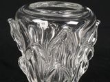 a close up of a glass vase on a black background
