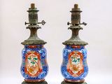 two vases that are sitting on a table