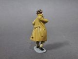 a figurine of a man in a yellow coat and hat