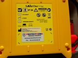 a yellow box with stickers on it sitting on a table