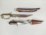 three different types of knives are displayed on a white surface