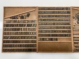 many different type of letters and numbers on this wooden box