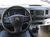dashboard view of a car with a steering wheel and dashboard controls