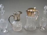 three glass and silver vases and a silver topper