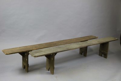 two wooden benches sitting next to each other on a white background