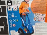 a box with a picture of a young boy riding a scooter