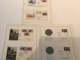 four different stamps on a table with a picture of a building