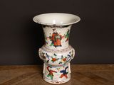 a vase that is sitting on top of a wooden table