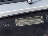 a close up of a car dashboard with a clock on it