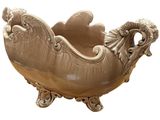 a large bowl that has a ram head on it