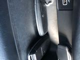 a close up of a car door handle with a key in it