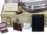 a suitcase that has a lot of items on it