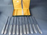 six knives in a case and six knives in the case