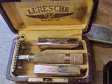 a box with a razor and a razor blade in it on a table
