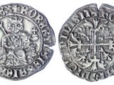 une pièce d'argent avec une croix au recto et une croix au verso