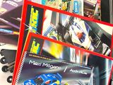 a lot of toy cars and books on the table