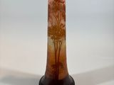 a vase that has a picture of a tree on it