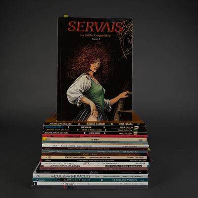 books stacked on top of each other on a black surface