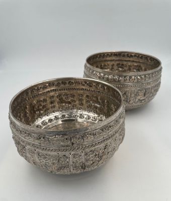 pair of silver plated bowls on white background with white background