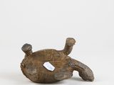 an image of a small turtle figurine with a tag on it ' s back