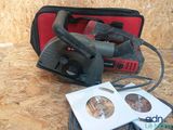 a picture of a corded sander and a tool bag on a table