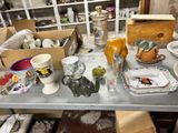 a table that has a lot of dishes and cups on it