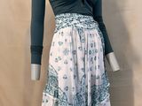 a mannequin wearing a dress with a blue top and white skirt