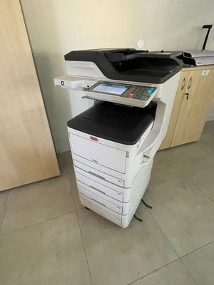a printer that is sitting on top of a cabinet