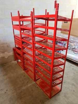 a red rack that has a lot of shelves on it