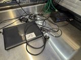 a laptop computer sitting on top of a metal table