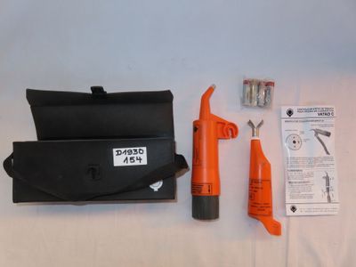 a black and orange tool set on a white table